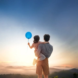Vater mit Tochter auf dem Arm